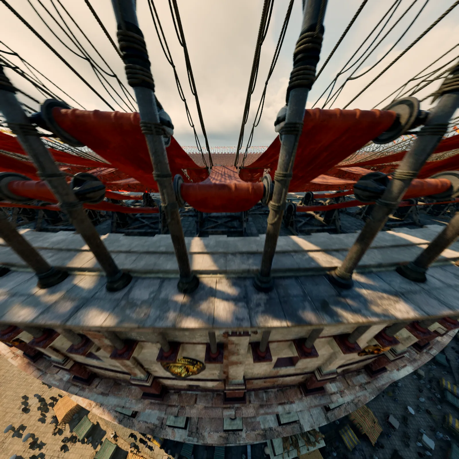 Looking down from the outer wall of the Colosseum onto the mast rig and ropes that carry the awning.